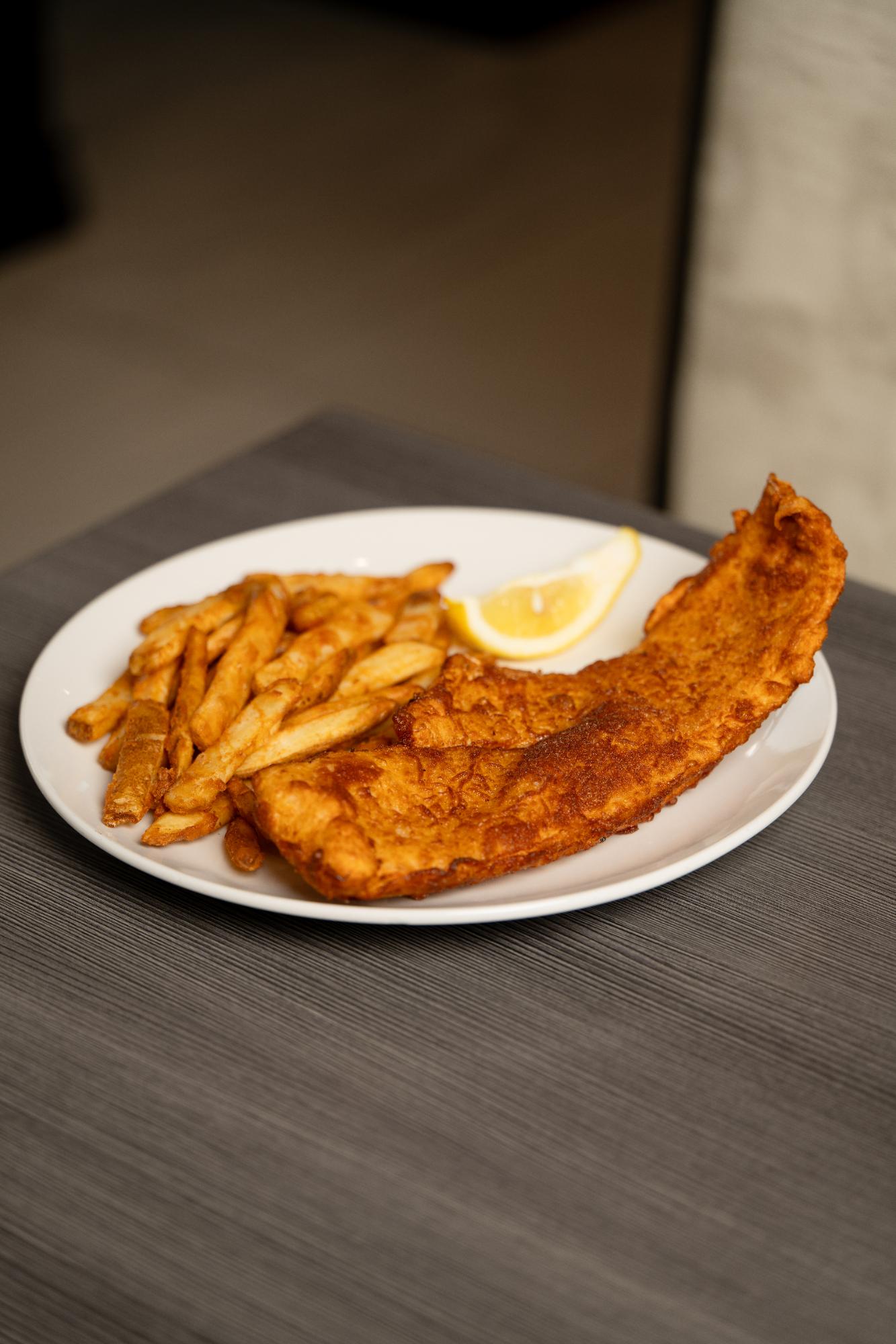 Hand battered Icelandic cod with fries and lemon