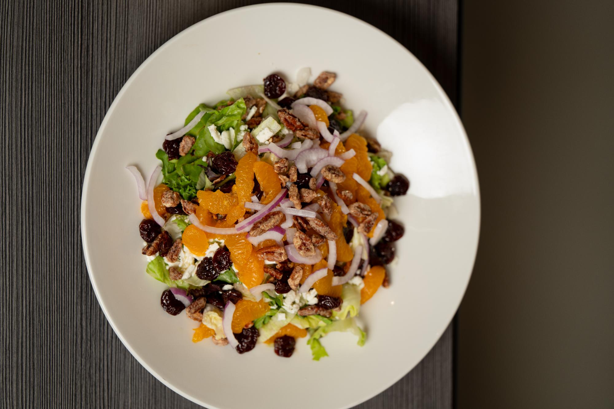 Joe's Salad with mandarin orange, dried cherry, candied pecans, feta and red onion